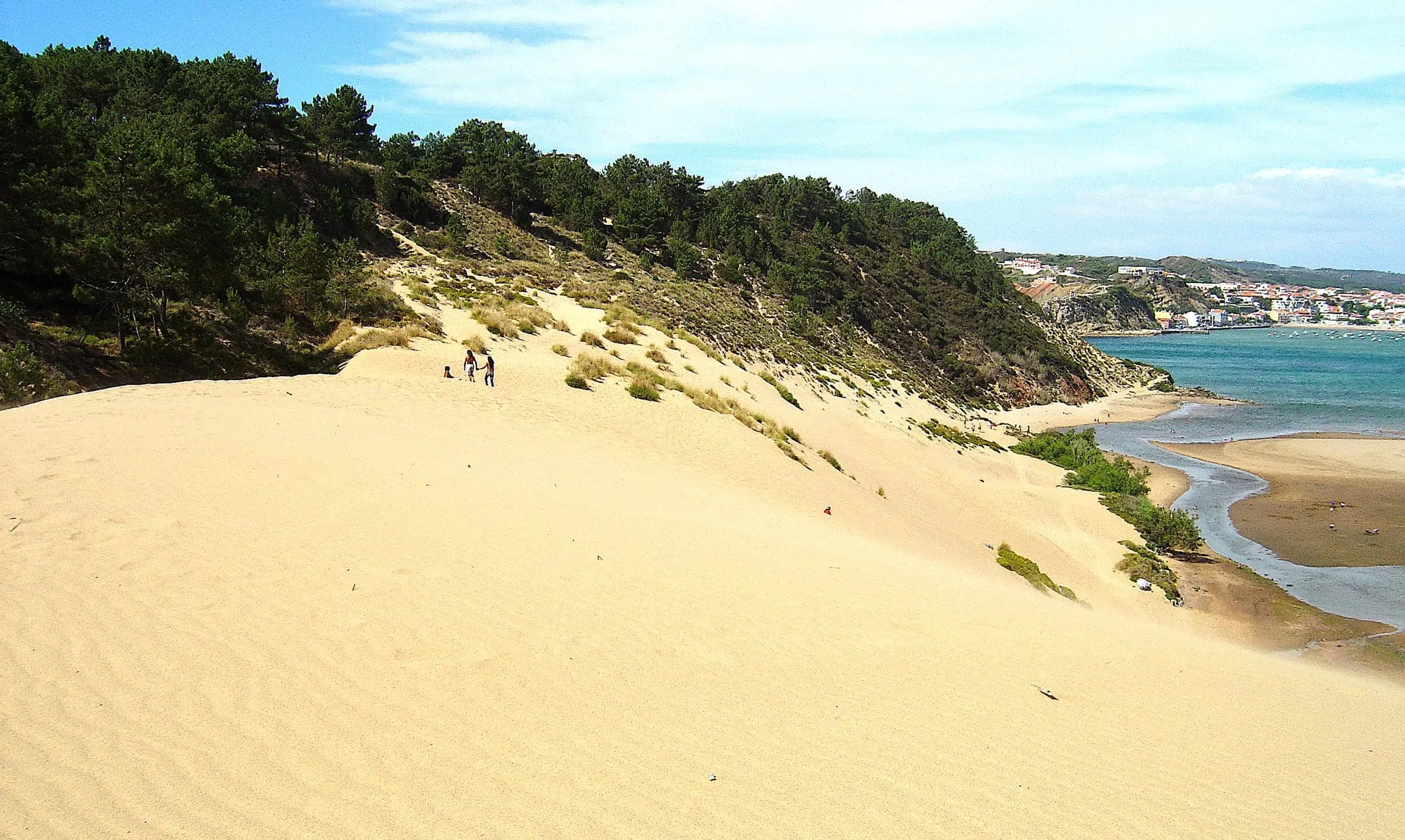Sand surfing at the huge sand dune at Salir do Porto
