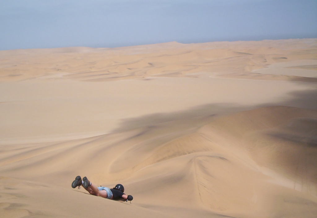 Sand sledding in Namibia