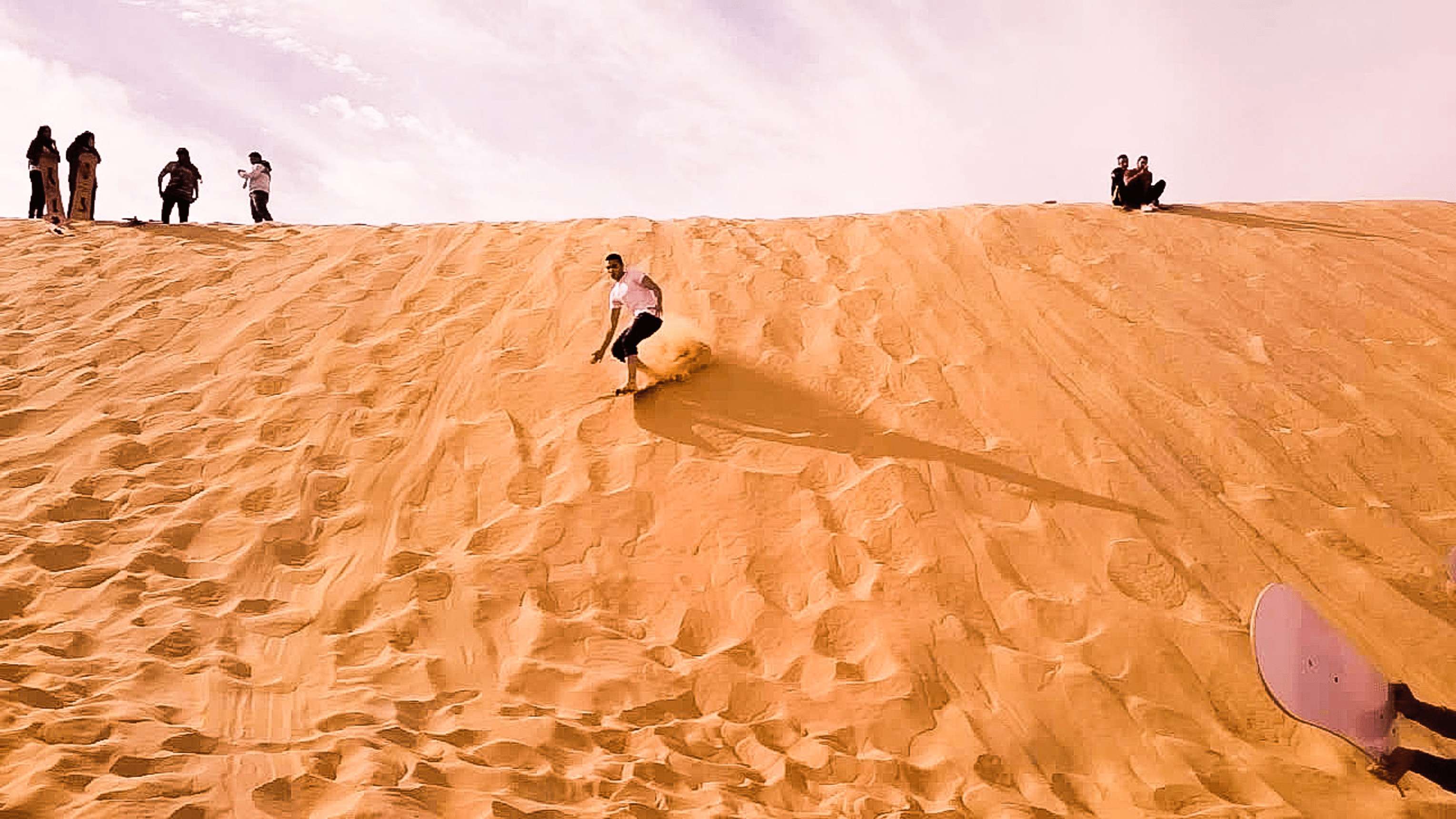 Sandboarding at the Wadi El-Rayan valley near Al Fayoum. Photo courtesy of Islam El-Bahnasawy.