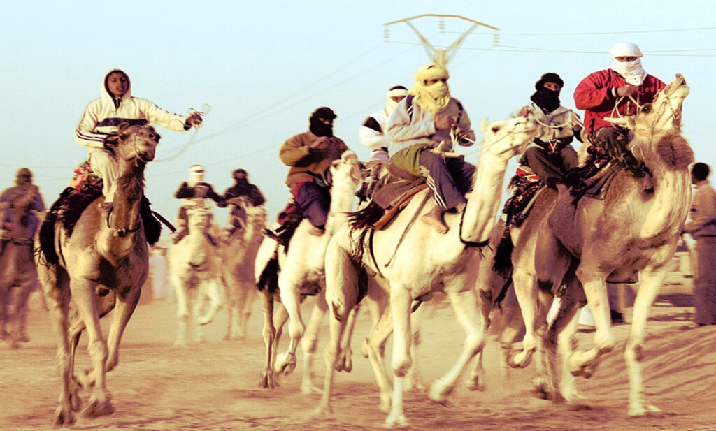 Jockeys Competing in a Camel Race in Algeria