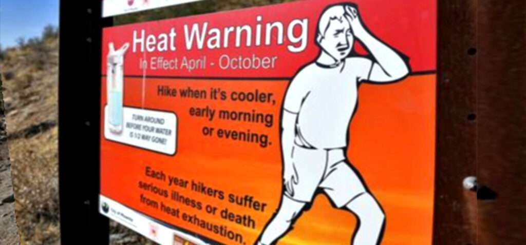 A sign warning hikers about the risks of heat stroke in Phoenix.