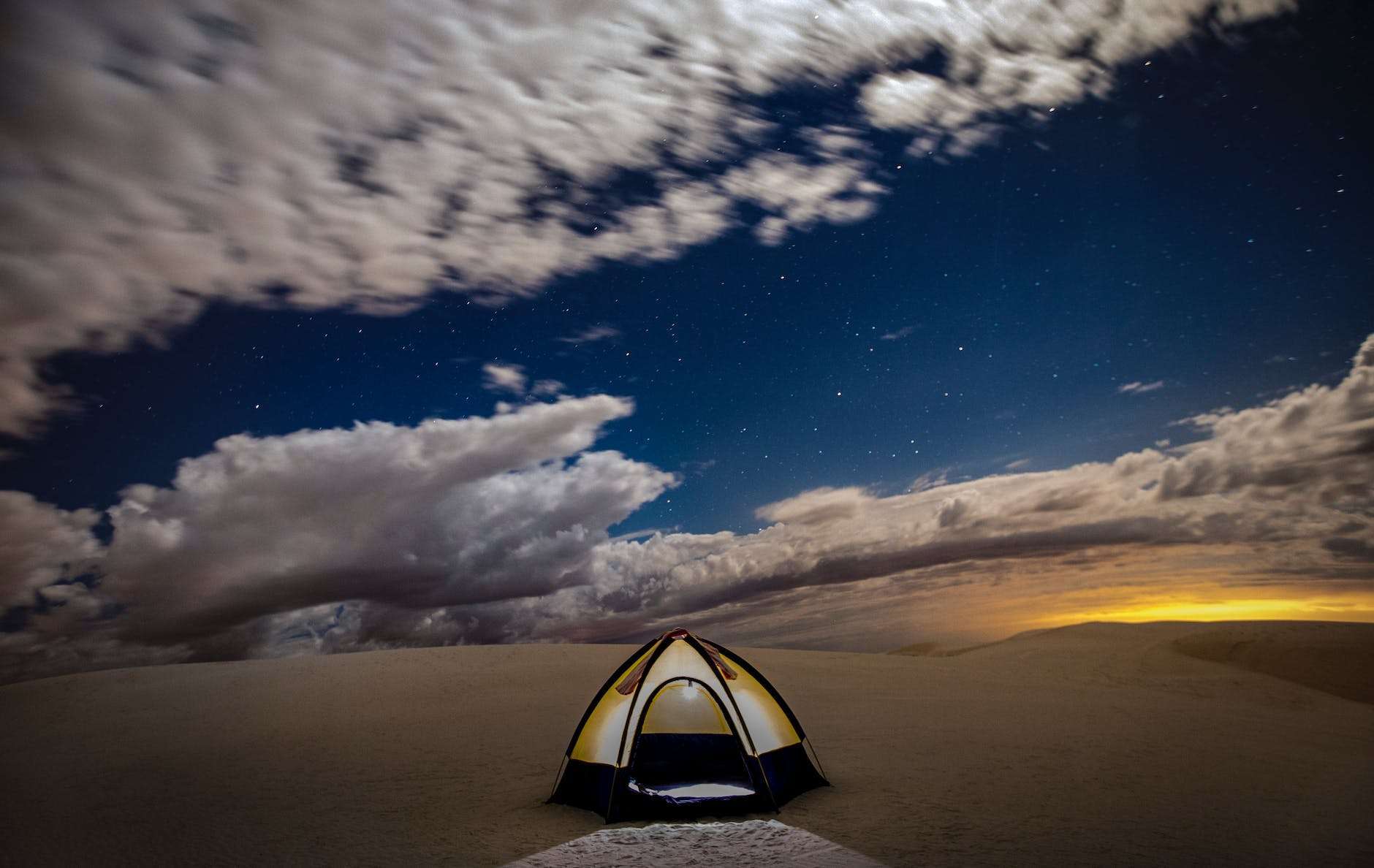 tent in the desert at dusk