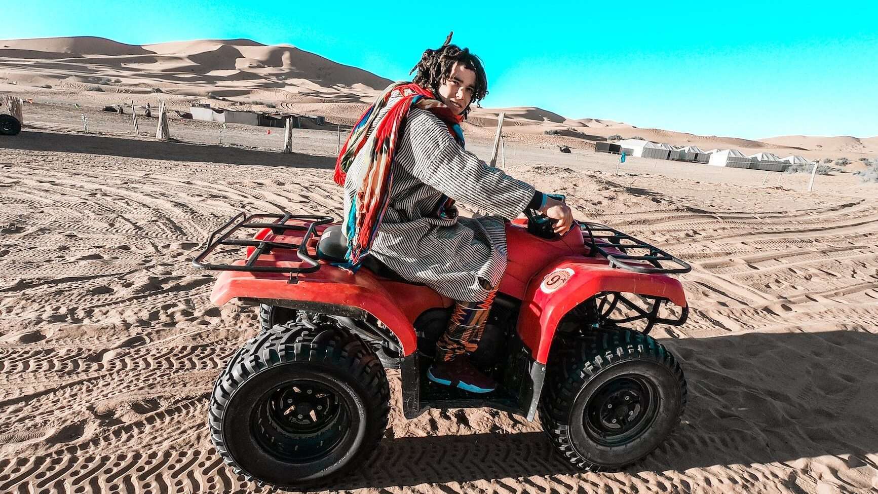 a man riding the Side-by-Side ATV on the desert