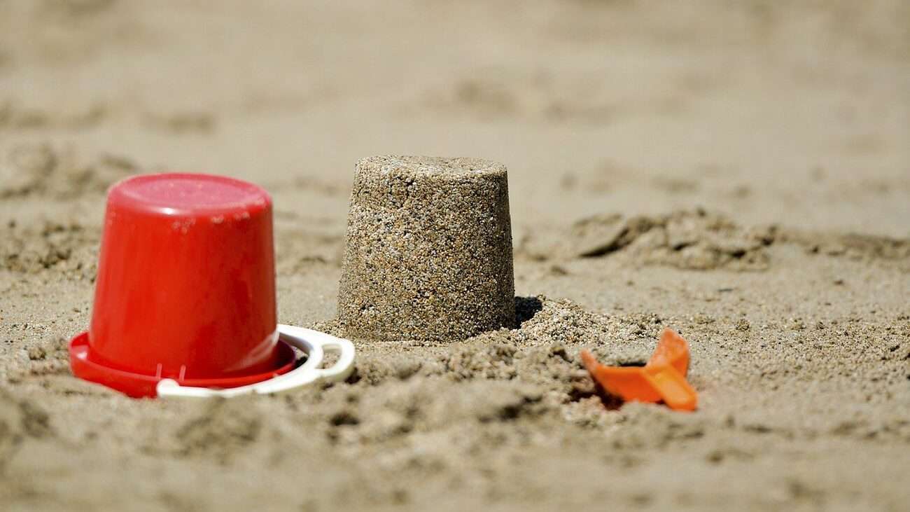 Sand castle with bucket at the beach