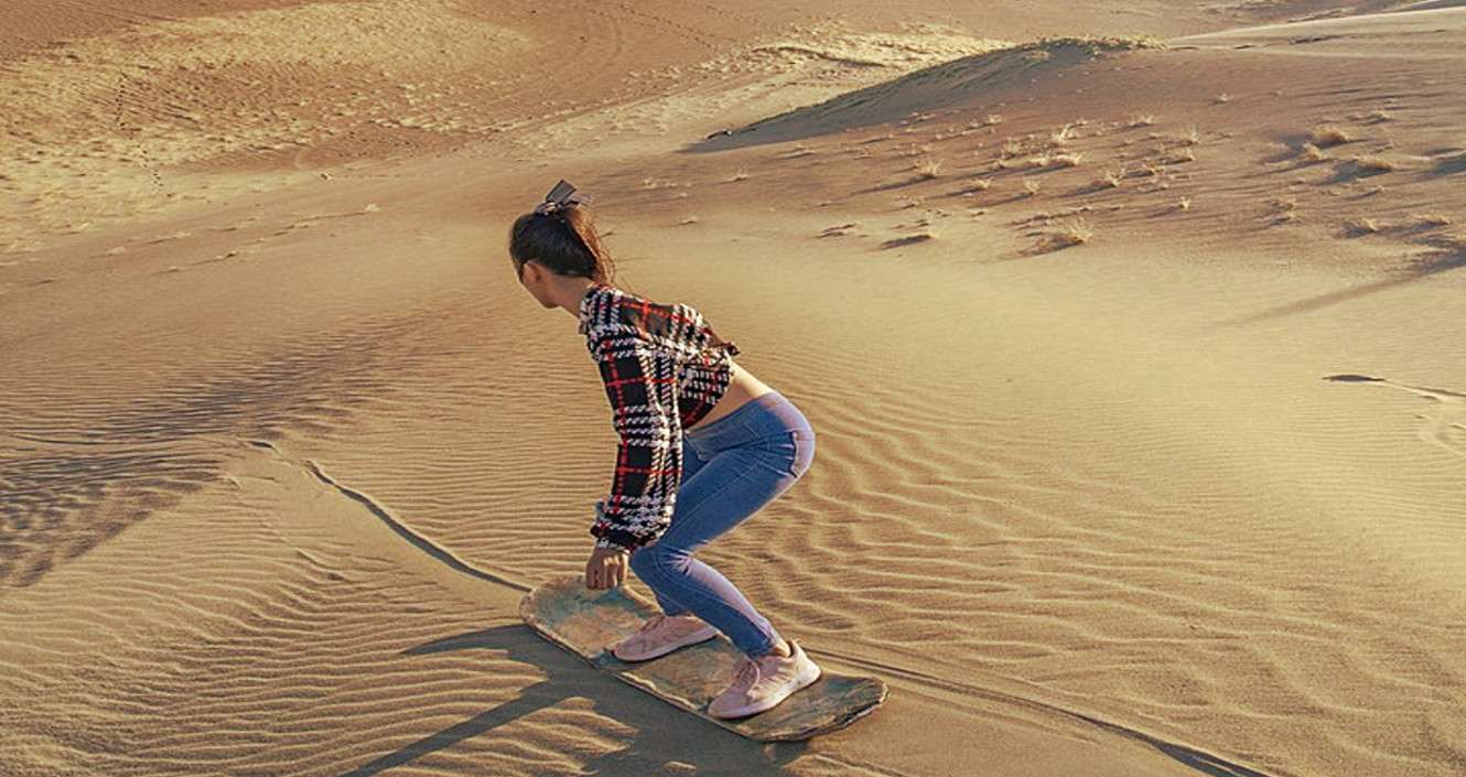 Woman sandboarding