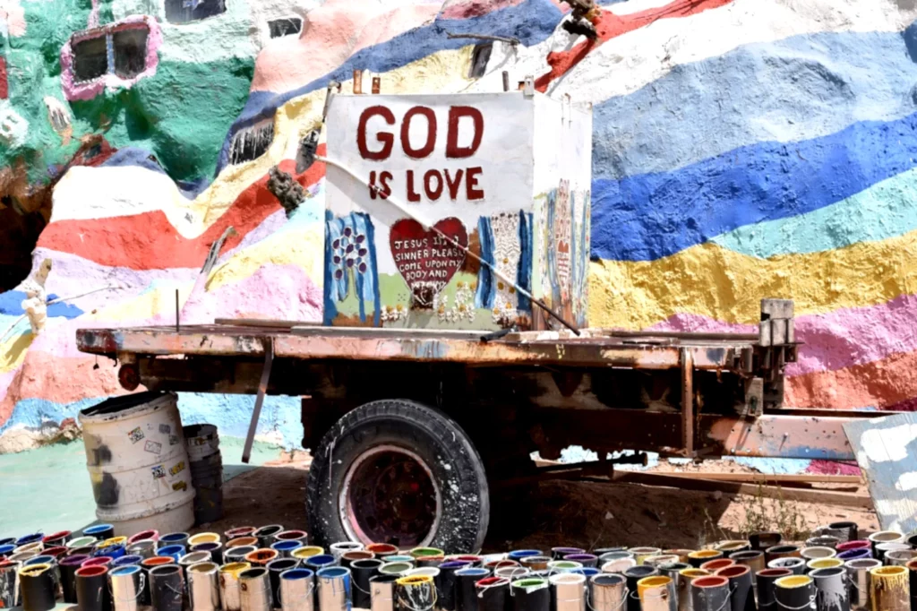 An art piece in Slab City with the message "God is Love."