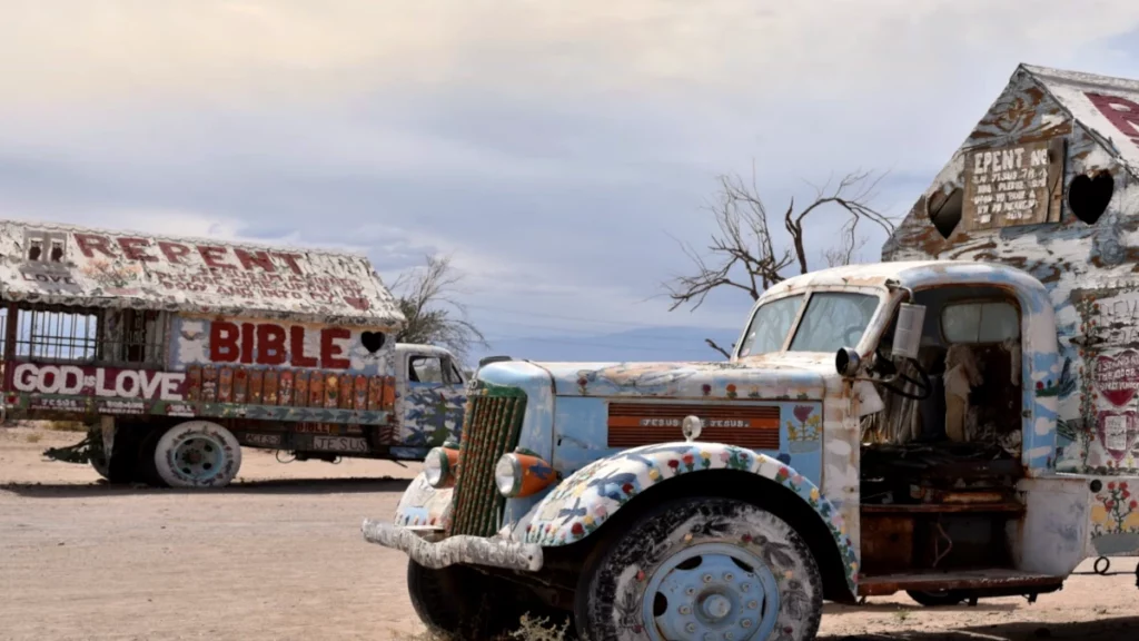 Caravans and trucks in Slab City display numerous religious messages