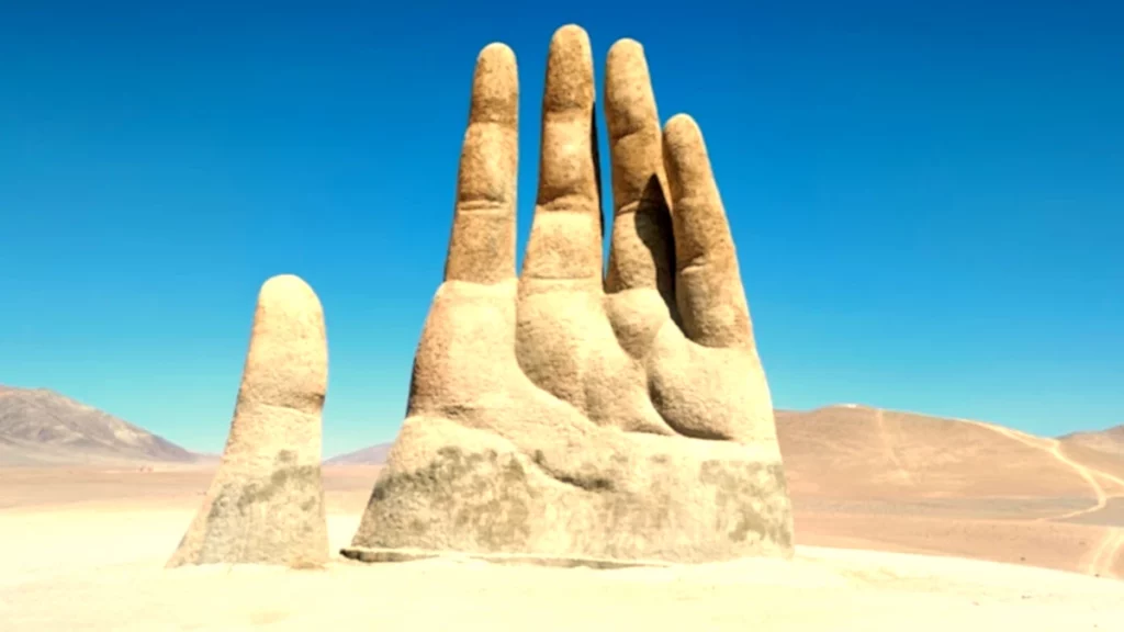The "Mano del Desierto" is a giant hand-shaped sculpture by Chilean sculptor Mario Irarrázabal locate in the middle of the Atacama desert.